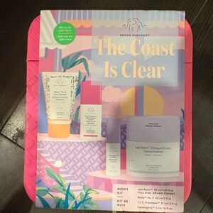 Drunk Elephant skincare set — pink, purple, yellow, cream, green